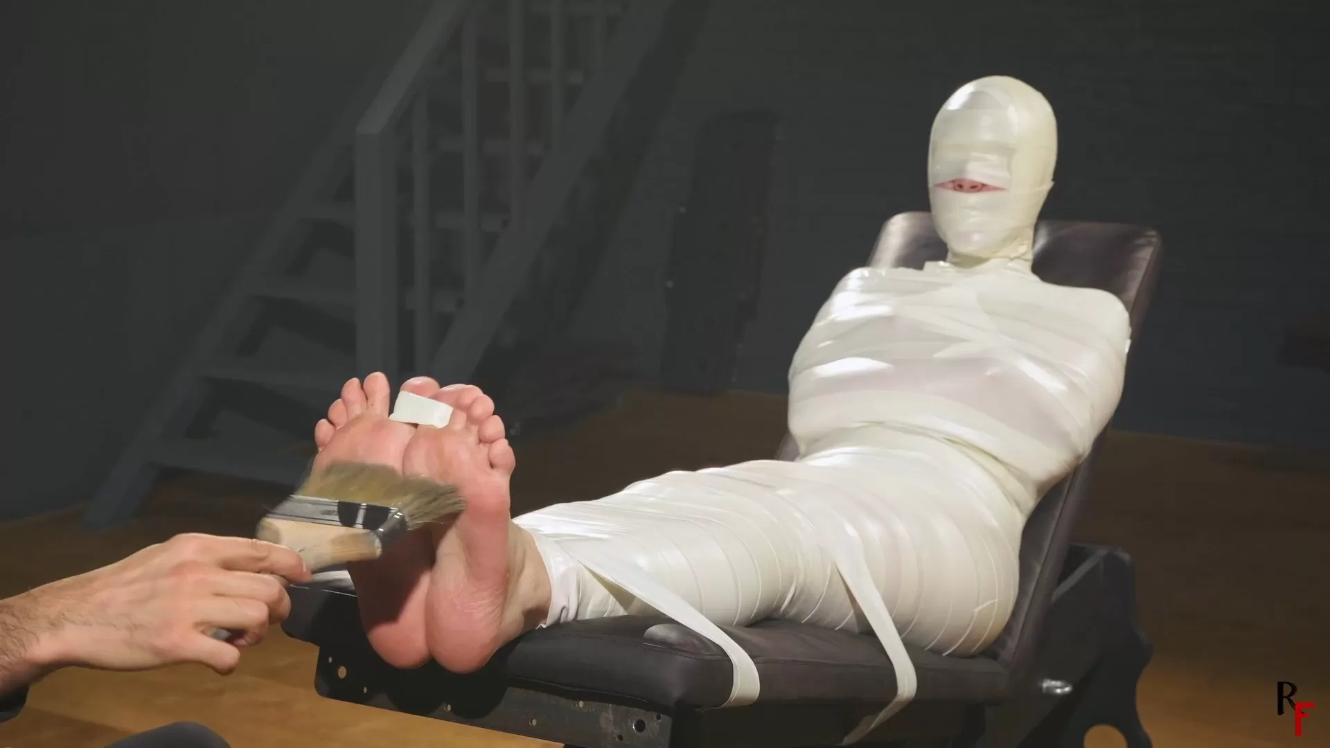 RFStudioProduction – Astrid in a Sleek Microfoam Cocoon Part 4 – Foot Tickling.webp